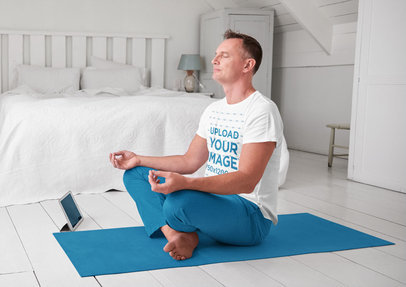 T-Shirt Mockup of a Middle-Aged Man Meditating at Home