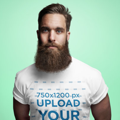 T-Shirt Mockup Featuring a Bearded Man in a Studio