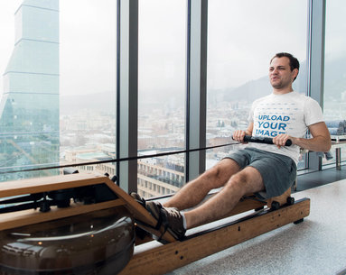 T-Shirt Mockup of a Man Doing Cable Rows at the Gym