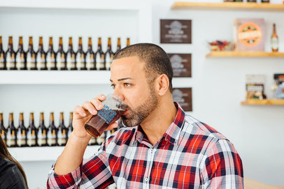 Mockup of a Man Drinking Beer From a Glass