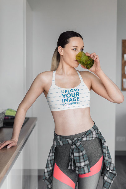 Sports Bra Mockup of a Woman Drinking Water at Home