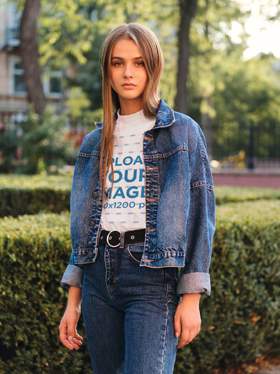 T-Shirt Mockup of a Woman Posing at a Park