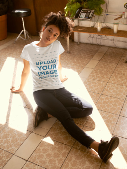 T-Shirt Mockup of a Woman Sitting on the Floor
