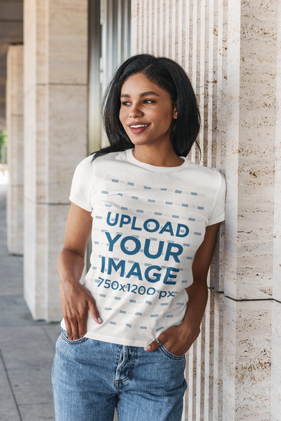 Mockup of a Woman Wearing a T-Shirt and Leaning Against a Granite Wall 