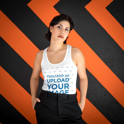 Mockup of a Serious Woman Wearing a Tank Top Against a Patterned Backdrop