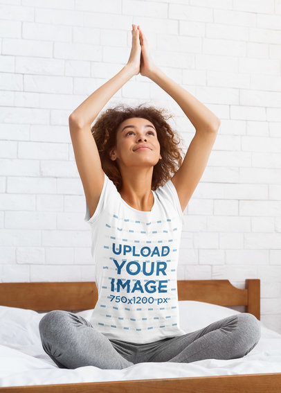 T-Shirt Mockup of a Woman Doing Yoga in the Bedroom 