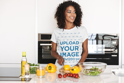 Tee Mockup of a Woman Chopping Vegetables in a Kitchen 38213-r-el2