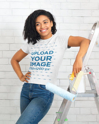 Heather T-Shirt Mockup of a Woman Painting a Wall 