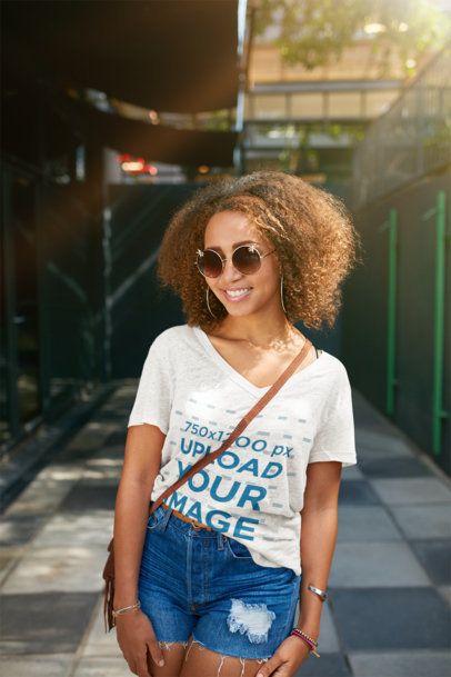 Mockup of a Smiling Woman with a Heathered V-Neck Tee Posing on the Street 38807-r-el2