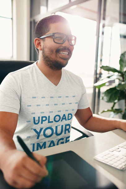 Mockup of a Smiling Man with a V-Neck Tee Working at an Office 34869-r-el2
