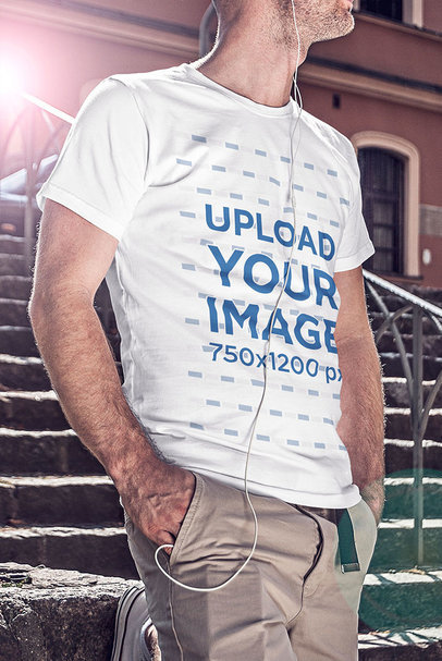 T-Shirt Mockup of a Man Standing by a Stone Staircase 