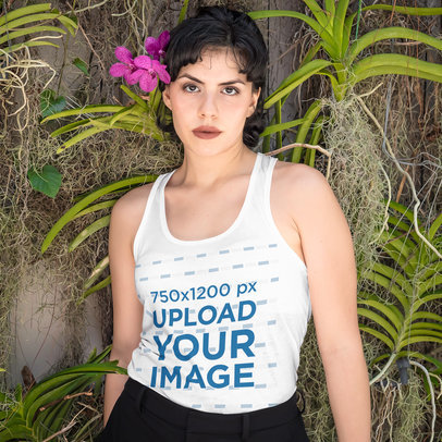 Tank Top Mockup Featuring a Short-Haired Woman Posing Against an Orchid Wall
