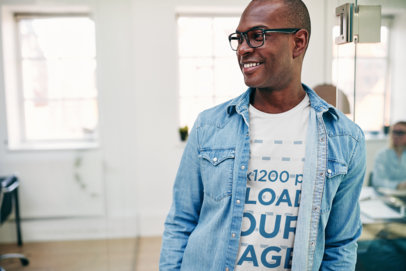 Mockup of a Smiling Man Wearing a Round Neck Tee Under a Denim Garment