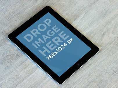 Mockup of a Black iPad on a Grey Table 