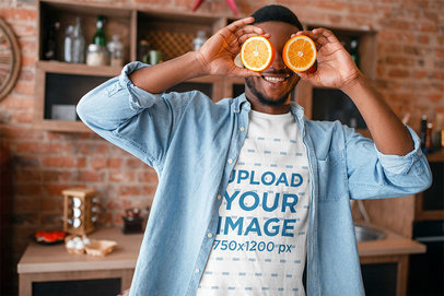 T-Shirt Mockup of a Man Playing with Two Orange Slices 38312-r-el2