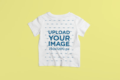 Back-View Mockup of a Kid's T-Shirt Placed on a Colored Surface 4869-el1