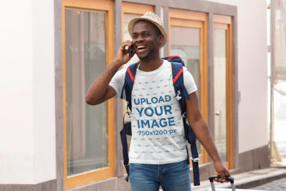T-Shirt Mockup of a Backpacker Talking on the Phone