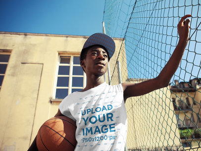 T-Shirt Mockup of a Teenager with a Basketball Ball 