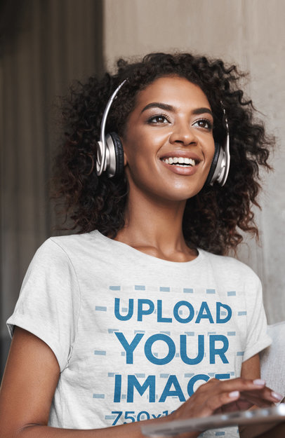 Mockup of a Woman with Headphones Wearing a T-Shirt