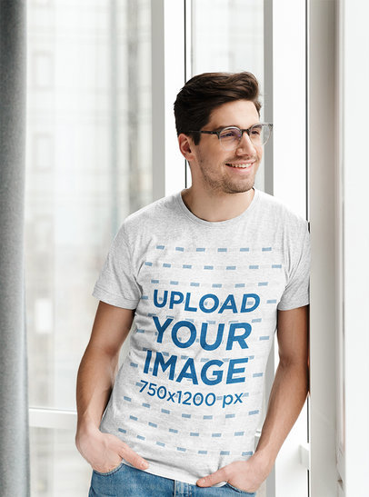 Heather T-Shirt of a Smiling Man Leaning on a Wall 