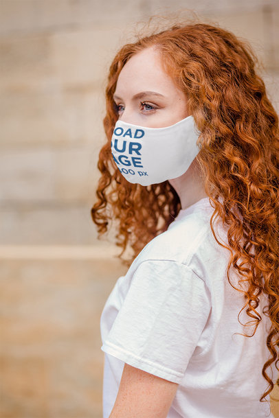 Mockup Featuring a Long-Haired Woman Wearing a Customizable Face Mask 