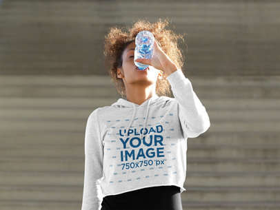 T-Shirt Mockup of a Fit Woman Wearing a Crop Top Hoodie