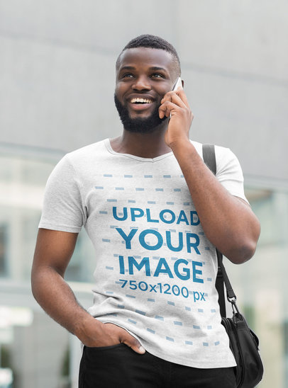 Mockup of a Man Wearing a Heathered T-Shirt While on the Phone