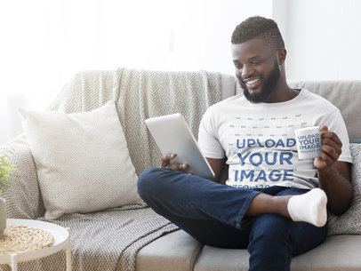 T-Shirt Mockup of a Bearded Man Holding a Coffee Mug at the Living Room 38863-r-el2