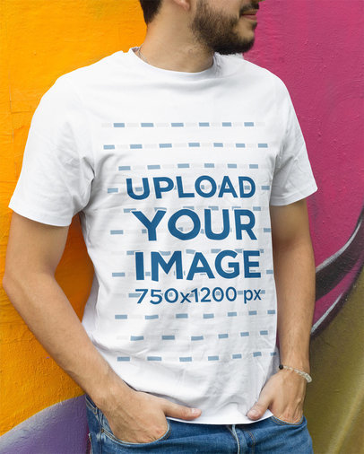 Cropped Face Mockup of a Man Wearing a Customizable T-Shirt Against a Wall With Graffiti