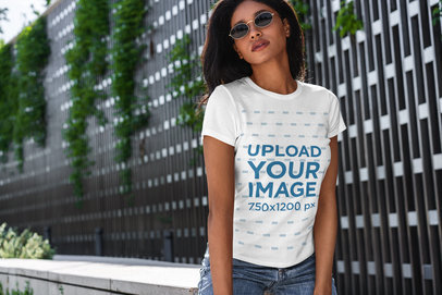 T-Shirt Mockup Featuring a Serious Woman with Sunglasses