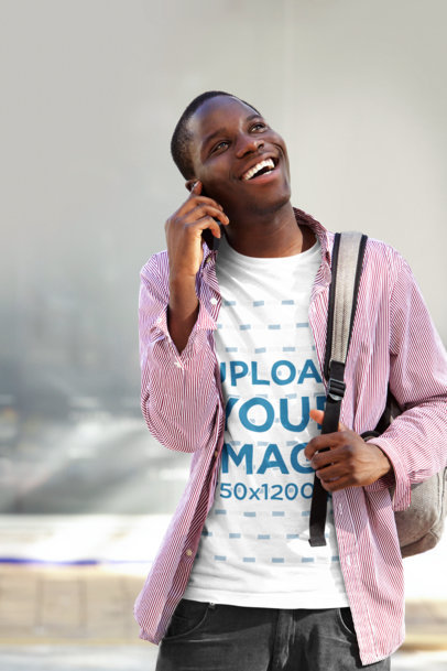 Tee Mockup of a Happy Man Talking on the Phone 