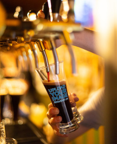 Mockup of Someone Serving Dark Beer in a Glass 36051-r-el2