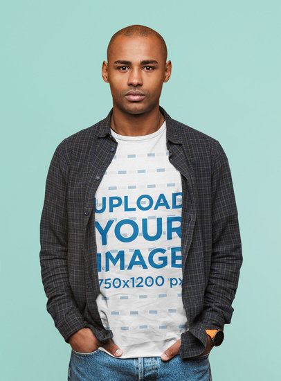 T-Shirt Mockup of a Serious Man Standing With His Hands on His Pockets