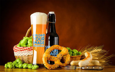 Mockup of a Glass and a Bottle of Beer Featuring a Pretzel
