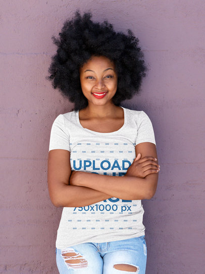 T-Shirt Mockup of a Woman with Natural Hair Leaning on a Wall