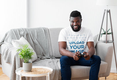 T-Shirt Mockup of a Man Playing Video Games at Home