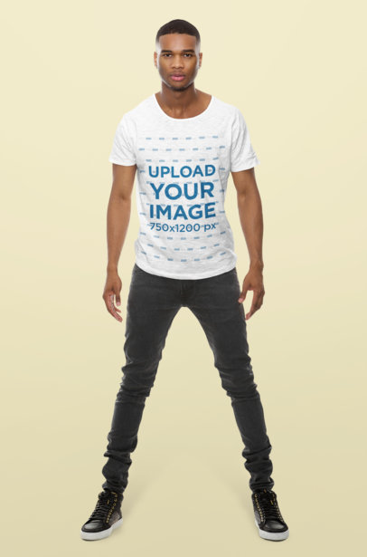 T-Shirt Mockup of a Man Standing in a Studio