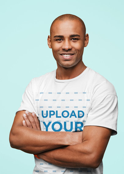 T-Shirt Mockup of a Man with Crossed Arms in a Studio