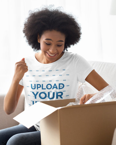 T-Shirt Mockup of an Excited Woman Opening a Package 38995-r-el2