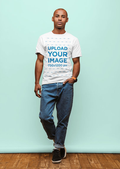 Mockup of a Serious Man Wearing a T-Shirt and Posing Against a Colored Backdrop