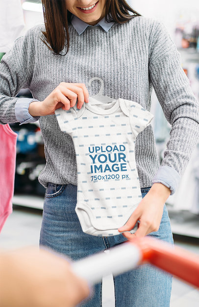 Mockup of a Woman Looking at an Onesie at the Mall 36240-r-el2