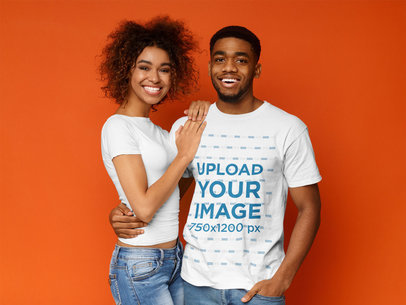 T-Shirt Mockup of a Man Posing with His Girlfriend at a Studio
