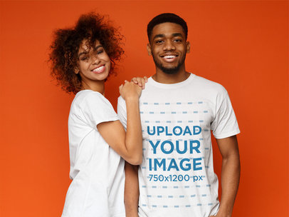 T-Shirt Mockup of a Man With His Girlfriend at a Studio
