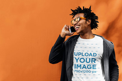 T-Shirt Mockup of a Man Laughing While Talking on the Phone