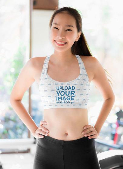 Sports Bra Mockup Featuring a Happy Woman at the Gym