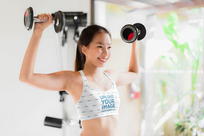 Sports Bra Mockup of a Woman Lifting Weights