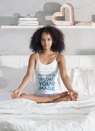 Mockup of a Woman with a Tank Top Meditating on Her Bed