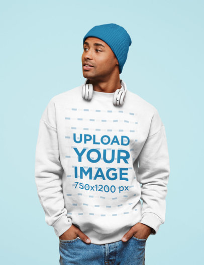 Sweatshirt Mockup of a Man with Headphones Posing at a Studio