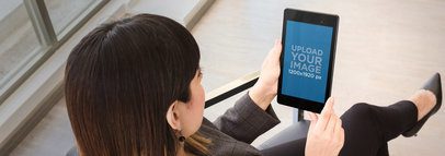 Mockup of a Business Woman Holding a Nexus 7