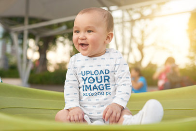 Mockup of a Baby Having Fun at a Park While Wearing a Sublimated Long Sleeve Tee 37339-r-el2